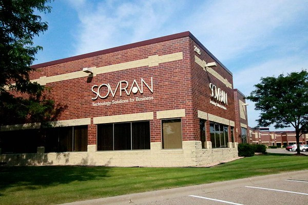Exterior of the Sovran building. Reddish brick with a silver logo sign