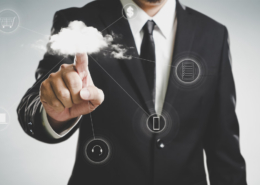 Man in a business suit using the cloud for storage, data, shopping, etc.