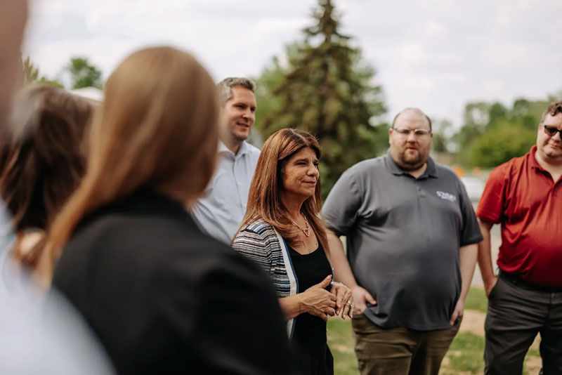 Sovran team members in a semi-circle during a team-building activity in Mendota Heights, MN.