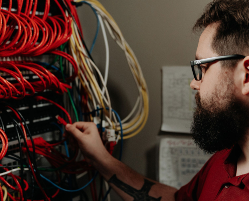 Sovran employee adjusting cables