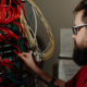 Sovran employee adjusting cables