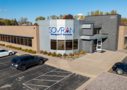 Drone picture of exterior of Sovran building front, brick and metal exterior.