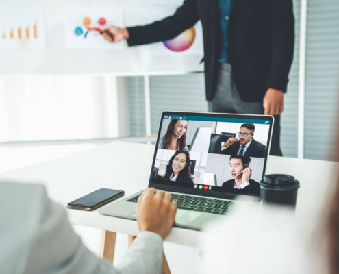 A woman using Microsoft Teams for a video call on her computer.